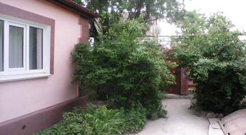 Фото номера Дом с 4 спальнями Гостиница Три Кита г. Николаевка 25